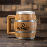 Barrel shaped wood mug with steel rings and wood handle and graphic of beer bottle cap and banner with text Cheers!