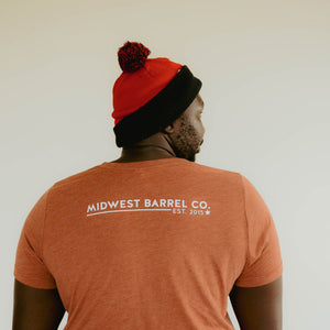 
                  
                    Back of burnt orange Beer Bourbon Brisket short sleeve shirt with Midwest Barrel Co. Est. 2015 on back
                  
                