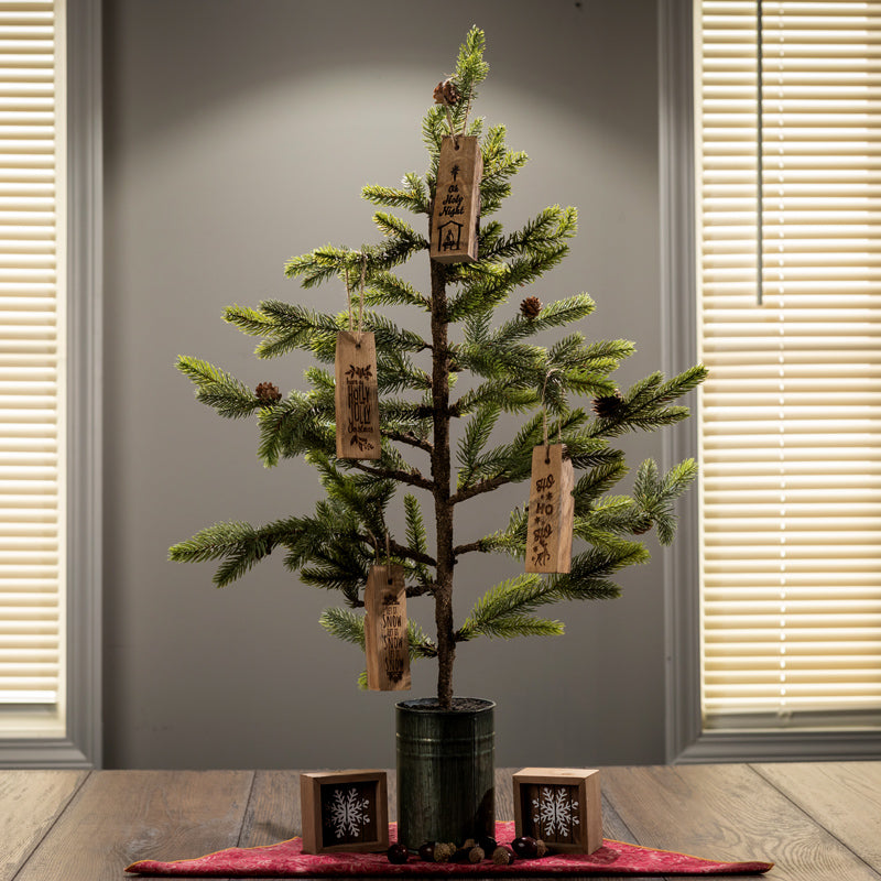 
                  
                    Christmas tree with wine barrel stave engraved ornaments on it
                  
                