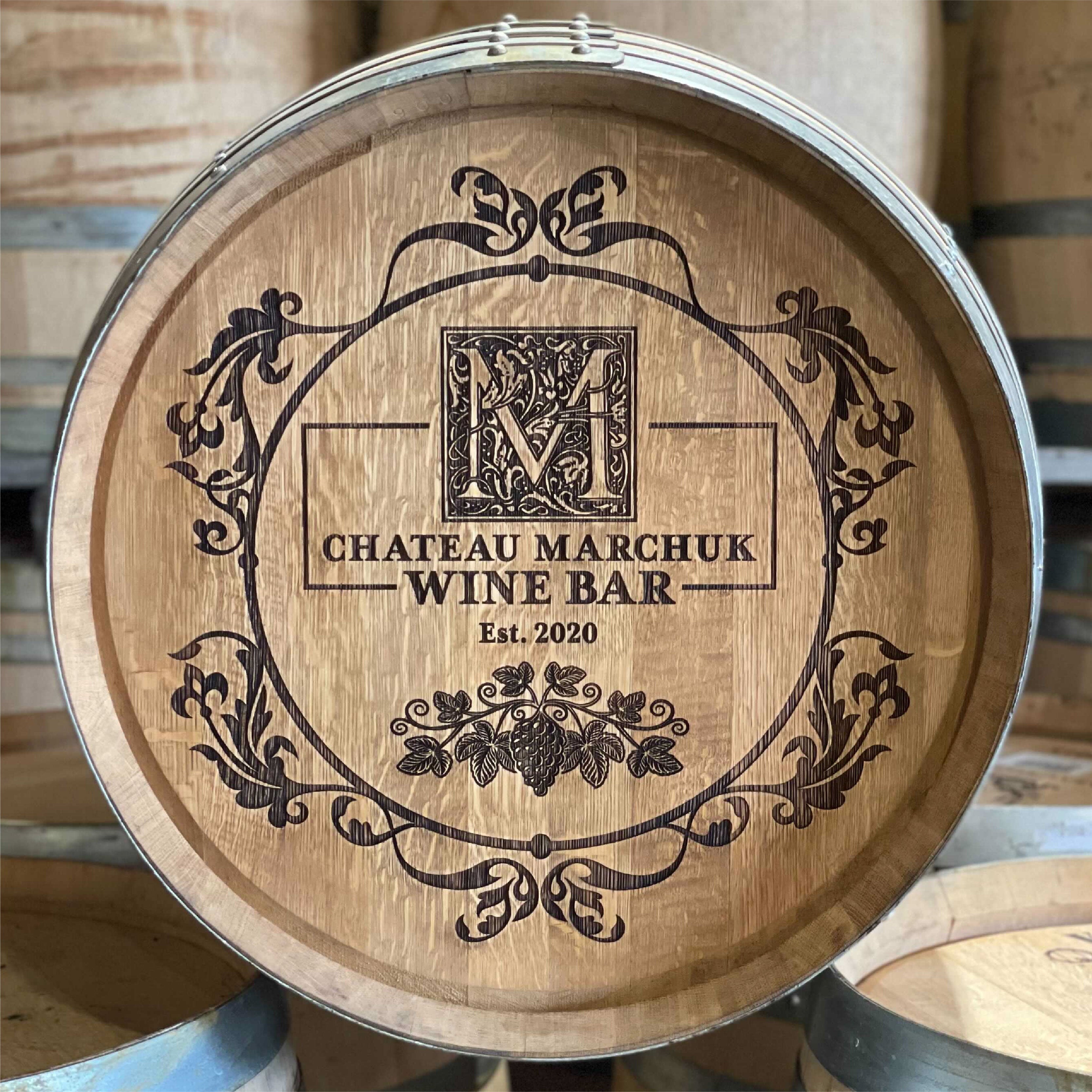 Custom, ornate, laser engraved wine barrel head for Chateau Marchuk Wine Bar Est. 2020 and floral and M initial