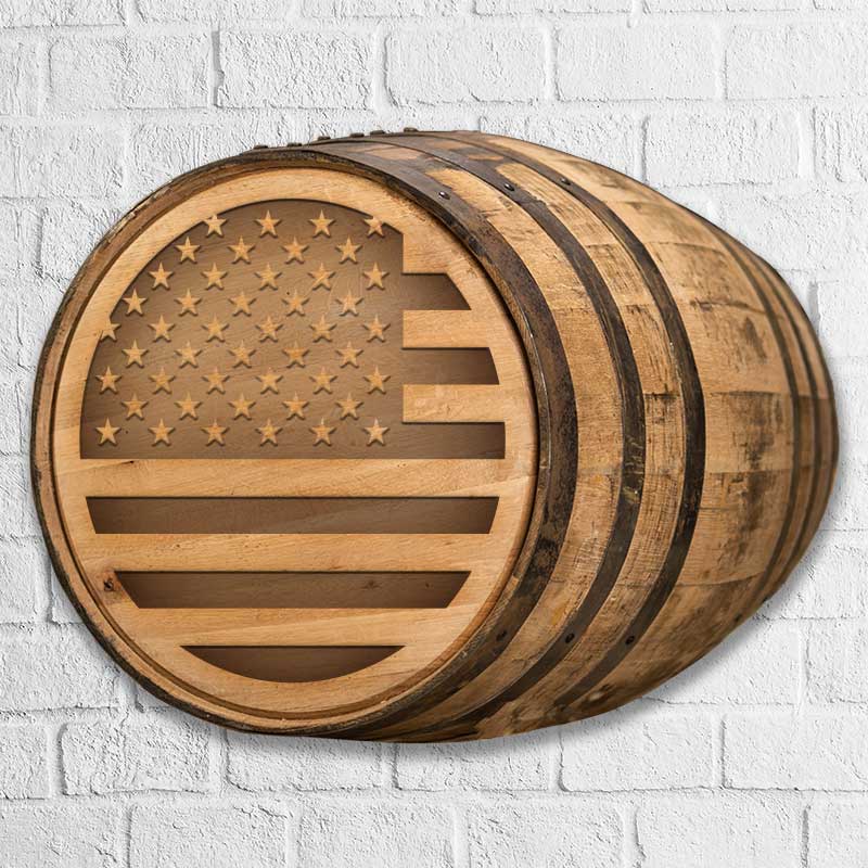 
                  
                    A full size whiskey barrel engraved with a circular image of the American flag on the head
                  
                
