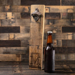 unopened beer bottle next to whiskey barrel stave bottle opener engraved with letter M in front of vertical rectangle