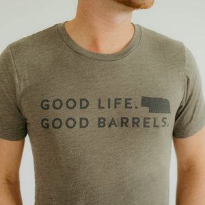 
                  
                    military green shirt with Good Life Good Barrels and state of Nebraska shape on front
                  
                
