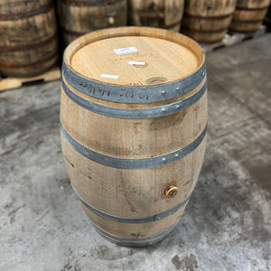 
                  
                    Head and side of a Hangar 1 Grape Vodka Barrel (Ex-Wine) with used whiskey barrels in the background
                  
                