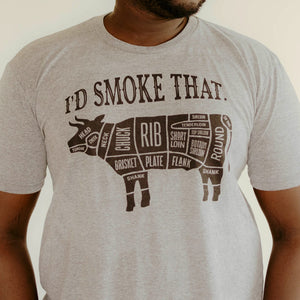 
                  
                    light gray t-shirt with text I'd Smoke That above a bull with cuts of meat labeled on the bull
                  
                