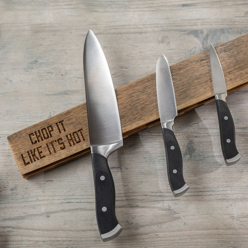 Whiskey barrel stave magnetic knife block with three knives and words 