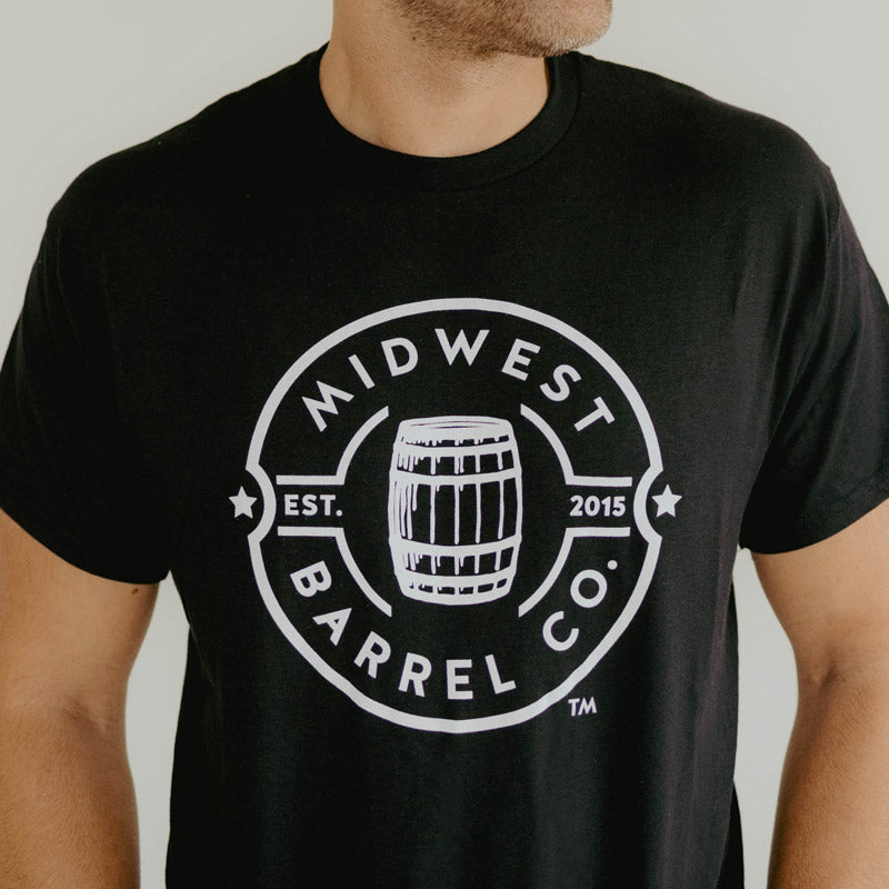 
                  
                    black shirt with white Midwest Barrel Co. circle logo with Est. 2015 around a bourbon barrel in the middle of the circle
                  
                