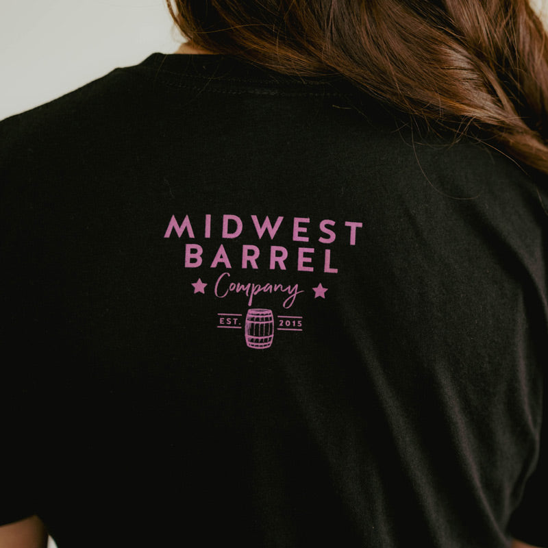 
                  
                    Small Midwest Barrel Company with barrel logo on the back of a black pink barrel t-shirt
                  
                