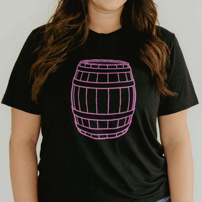 
                  
                    black t-shirt with a large, pink barrel drawing on the front
                  
                