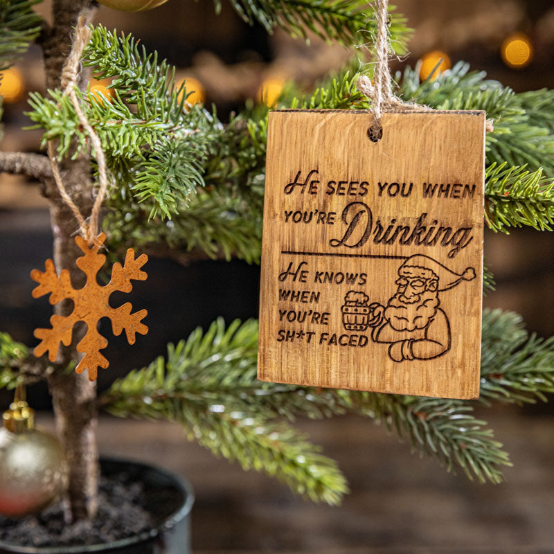 
                  
                    Engraved square wine barrel stave ornament engraved with Santa drinking beer from a barrel mug and text he sees you when you're sleeping he knows when you're shit faced
                  
                