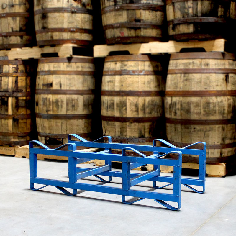 Used 2-Barrel 25/30 Gallon Steel Rack on floor in front of whiskey barrels on pallets