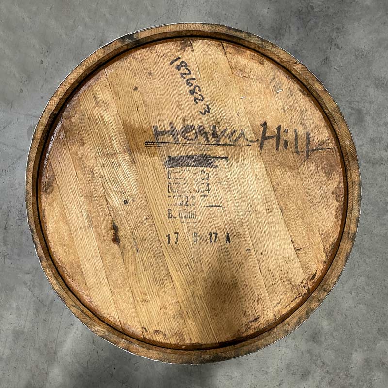 
                  
                    Barrel head with distillery markings and Heaven Hill handwritten on the head
                  
                